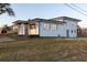 A multi-story residence showing the architectural design and backyard landscape at 2061 S Peninsula Dr, Daytona Beach, FL 32118