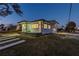 A well-maintained home with a modern design and a neatly kept lawn and driveway at 2061 S Peninsula Dr, Daytona Beach, FL 32118