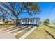 A beautiful house with a modern design, complete with a well-kept lawn and paved walkway at 2061 S Peninsula Dr, Daytona Beach, FL 32118