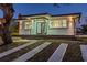Charming single-story home featuring a well-manicured lawn, fresh paint, and a inviting front entrance at 2061 S Peninsula Dr, Daytona Beach, FL 32118