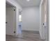 Hallway featuring new floors and neutral paint provides access to rooms throughout the house at 2061 S Peninsula Dr, Daytona Beach, FL 32118