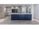 Modern kitchen featuring a large island, sleek cabinets, and stainless steel appliances at 2061 S Peninsula Dr, Daytona Beach, FL 32118