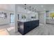 Open concept living area with kitchen featuring a large blue island and stainless appliances at 2061 S Peninsula Dr, Daytona Beach, FL 32118