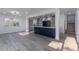 Open concept living area with kitchen featuring a large blue island and stainless appliances at 2061 S Peninsula Dr, Daytona Beach, FL 32118