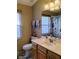 Bathroom featuring a single vanity, medicine cabinet, and shower with butterfly curtain at 250 Sir Phillips Dr, Davenport, FL 33837