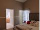 En-suite bedroom provides access to a vanity and a water closet at 250 Sir Phillips Dr, Davenport, FL 33837