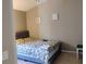 Simple bedroom featuring neutral walls, tile floors, and queen size bed at 250 Sir Phillips Dr, Davenport, FL 33837