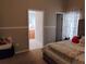 Bedroom with attached bathroom and walk-in closet at 250 Sir Phillips Dr, Davenport, FL 33837