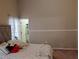 Cozy bedroom with tufted headboard and decorative throw pillows at 250 Sir Phillips Dr, Davenport, FL 33837