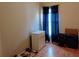 Bedroom featuring a dresser, tile floors, and blue blackout curtains at 250 Sir Phillips Dr, Davenport, FL 33837
