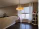 Cozy dining area with modern light fixture and bright window at 250 Sir Phillips Dr, Davenport, FL 33837