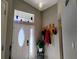 Foyer with oval front door, high ceilings, and decorative coat rack creates a welcoming space at 250 Sir Phillips Dr, Davenport, FL 33837
