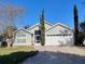 Charming single Gathering home featuring a two-car garage, well-manicured lawn, and mature landscaping at 250 Sir Phillips Dr, Davenport, FL 33837