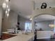 Open kitchen area offers view to living room and bright decorative lighting at 250 Sir Phillips Dr, Davenport, FL 33837