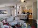 Open concept living area featuring vaulted ceilings, modern lighting, and seamless kitchen access at 250 Sir Phillips Dr, Davenport, FL 33837