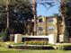 Well-maintained apartment complex featuring lush landscaping and mature palm trees at 2558 Robert Trent Jones Dr # 1412, Orlando, FL 32835