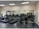 Well-equipped fitness center with treadmills, ellipticals, and a full mirrored wall at 2558 Robert Trent Jones Dr # 1412, Orlando, FL 32835
