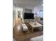 Bright living room featuring hard surface floors, ceiling fan, and open concept floorplan at 2558 Robert Trent Jones Dr # 1412, Orlando, FL 32835