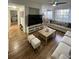 Bright living room featuring hard surface floors, ceiling fan, and large windows at 2558 Robert Trent Jones Dr # 1412, Orlando, FL 32835
