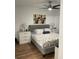 Comfortable main bedroom with a ceiling fan, side tables and matching lamps for a calming retreat at 2558 Robert Trent Jones Dr # 1412, Orlando, FL 32835