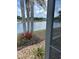 Lakeside backyard blending serene water views with unique landscaping, perfect for relaxation and outdoor enjoyment at 2812 Tower Rock St, Kissimmee, FL 34758