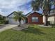 Charming single-Gathering home with a well-manicured lawn and a lovely palm tree at 2812 Tower Rock St, Kissimmee, FL 34758