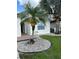 Charming home featuring a freshly painted exterior with meticulous landscaping and a vibrant palm tree at 2812 Tower Rock St, Kissimmee, FL 34758