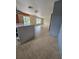 Open-concept living room with tile floors, natural light, and access to the backyard at 2812 Tower Rock St, Kissimmee, FL 34758