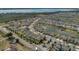 Aerial view of homes in a residential neighborhood along a lake at 2884 Nottel Dr, St Cloud, FL 34772