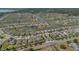 Aerial view of homes in a residential neighborhood situated on canals and a lake at 2884 Nottel Dr, St Cloud, FL 34772