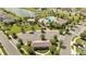 Aerial image showcasing a community clubhouse, pool, parking, and recreational area in a well maintained community at 2884 Nottel Dr, St Cloud, FL 34772