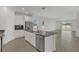 Beautiful kitchen featuring stainless steel appliances, a central island, and sleek countertops at 2884 Nottel Dr, St Cloud, FL 34772