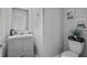 Charming bathroom with modern vanity, mirror, and neutral tones at 293 Pineywoods St, St Cloud, FL 34772