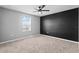 Bedroom with a ceiling fan, neutral paint colors and carpet flooring at 293 Pineywoods St, St Cloud, FL 34772