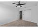 Bright bedroom with closet, ceiling fan, carpet flooring, and neutral walls at 293 Pineywoods St, St Cloud, FL 34772