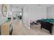 Bright entryway showcasing a decorative mirror, stylish console table, and view into the living area at 293 Pineywoods St, St Cloud, FL 34772