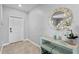 Inviting entryway features decorative mirror, and tile flooring at 293 Pineywoods St, St Cloud, FL 34772