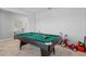 Game room with pool table, tile floors and natural light at 293 Pineywoods St, St Cloud, FL 34772