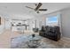 Open living space with modern furnishings and connecting dining and kitchen areas at 293 Pineywoods St, St Cloud, FL 34772