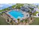 Beautiful community pool with lounge chairs and a picnic area, perfect for relaxation and recreation at 293 Pineywoods St, St Cloud, FL 34772