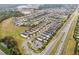 Wide aerial view showing the community, roadways, and nearby amenities at 301 Pendant Ct, Kissimmee, FL 34747