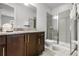 Bathroom featuring granite countertops, modern fixtures, and a glass-enclosed shower at 301 Pendant Ct, Kissimmee, FL 34747