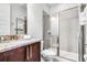 Bathroom featuring granite counters, vanity, toilet, and glass-enclosed shower at 301 Pendant Ct, Kissimmee, FL 34747