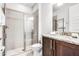 Bathroom featuring granite counters, vanity, toilet, and glass-enclosed shower at 301 Pendant Ct, Kissimmee, FL 34747