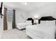 Bright bedroom featuring two beds, carpeted floors, and a sunny window view at 301 Pendant Ct, Kissimmee, FL 34747