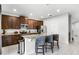 This updated kitchen includes modern stainless appliances, dark cabinets, and a large kitchen island at 301 Pendant Ct, Kissimmee, FL 34747