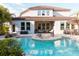 Stunning backyard featuring a spacious pool and patio area, great for entertaining at 3100 Stonewyck St, Orlando, FL 32824