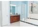 Bright bathroom with a soaking tub, marble countertop vanity, a framed mirror, and a walk-in shower at 3100 Stonewyck St, Orlando, FL 32824
