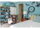 Stylish bedroom with blue walls, a wooden bookshelf, and bike decor on the wall at 3100 Stonewyck St, Orlando, FL 32824