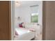 Bright bedroom featuring a cozy bed, dresser, study desk and a window that offers serene outdoor views at 3100 Stonewyck St, Orlando, FL 32824